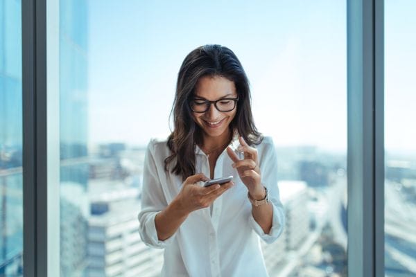 Woman Using Her Mobile Phone CEO meeting with company management